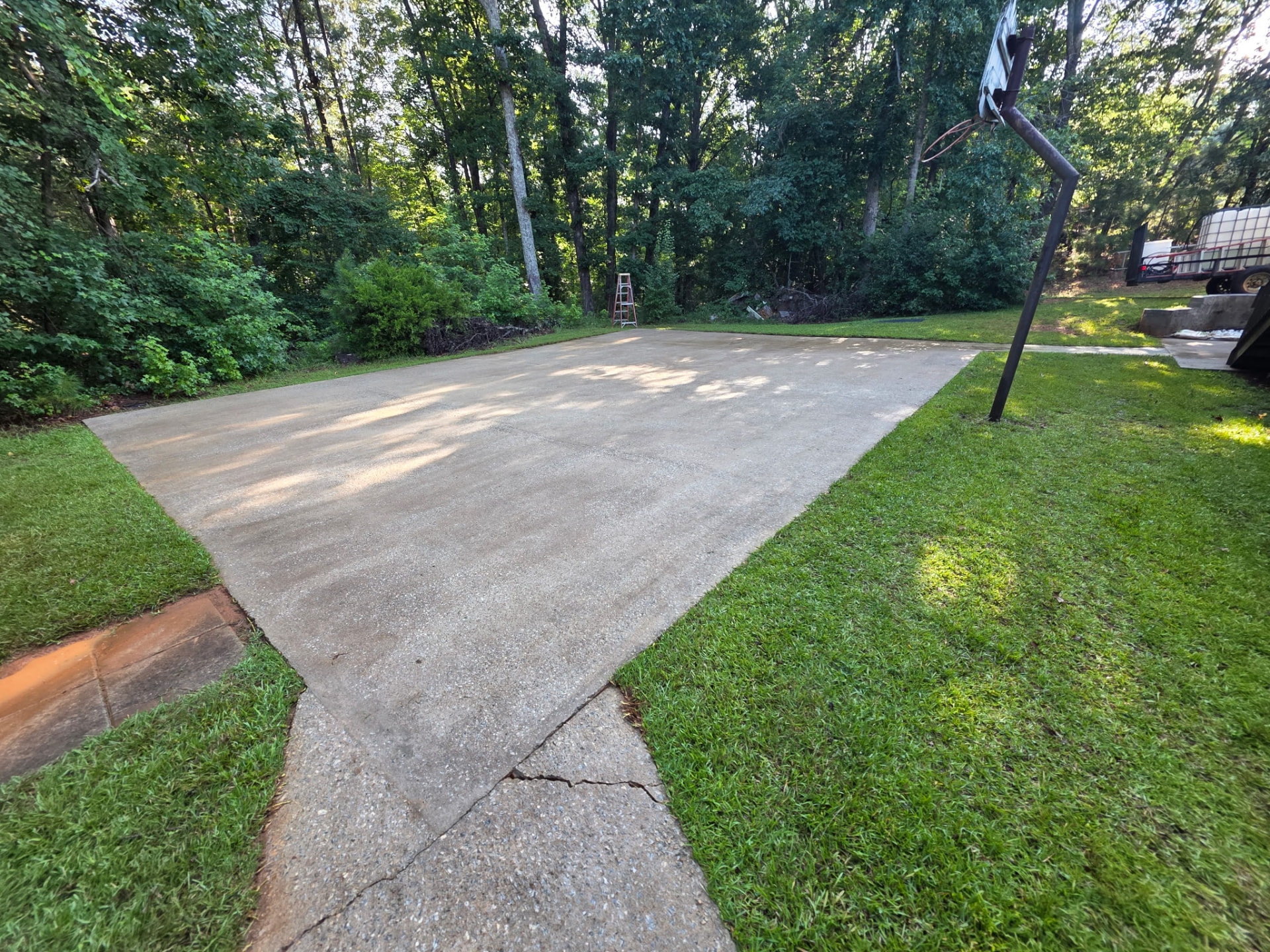 Backyard Court & Slab Restoration before and after pressure washing