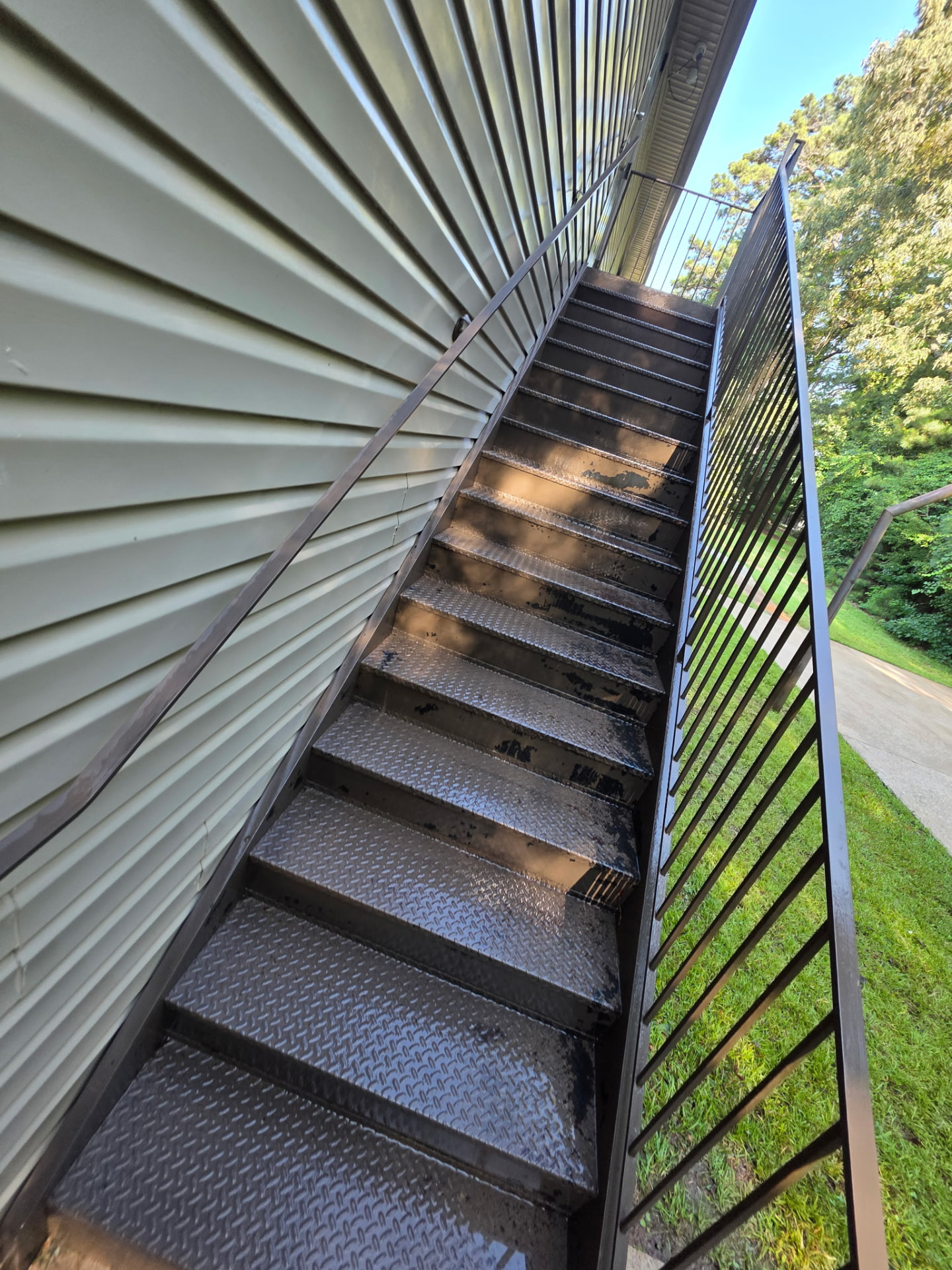 Exterior Metal Stair Tower before and after pressure washing